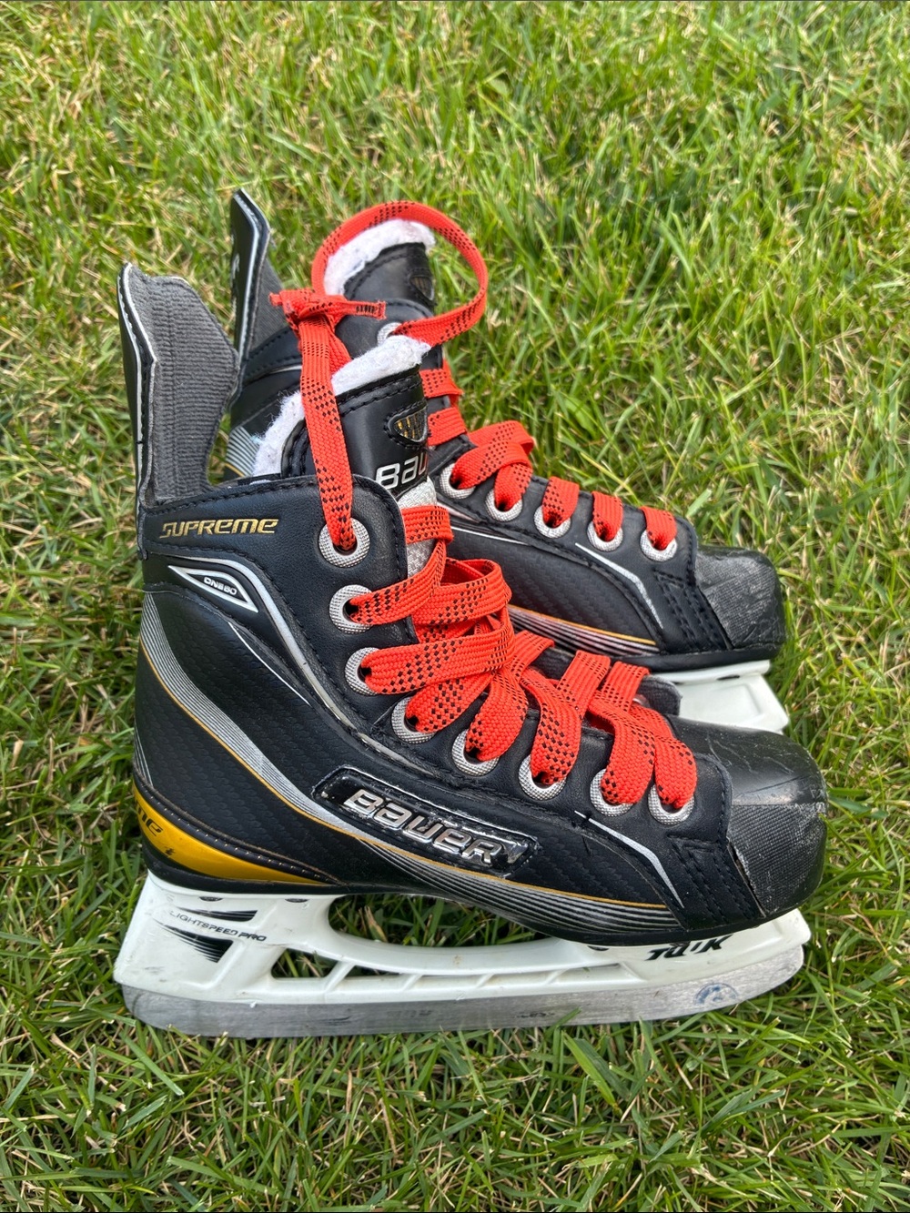 Kids Bauer Supreme Ice Skates with Orange Laces